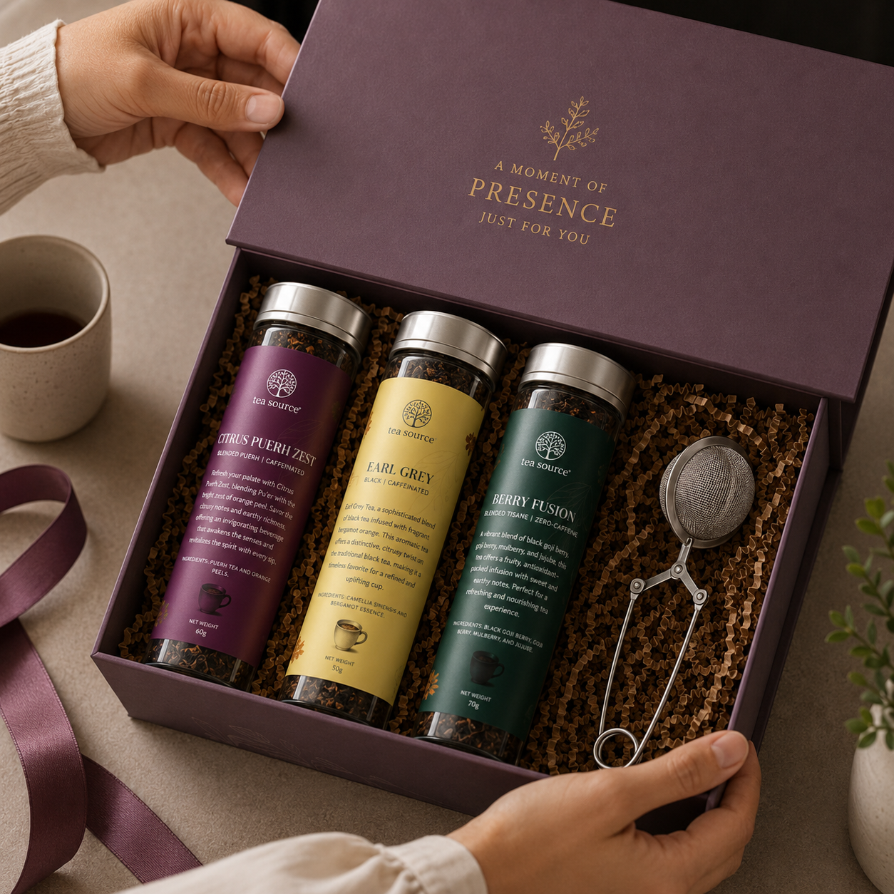 Hands tying a ribbon on a custom corporate tea gift box