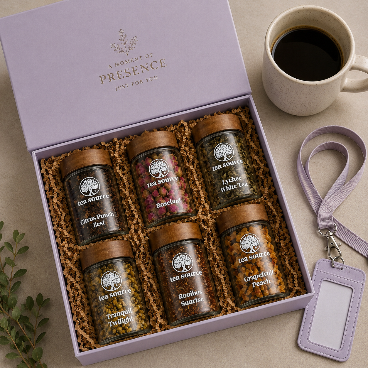 Flat lay of a corporate tea gift set with notebook and coffee mug