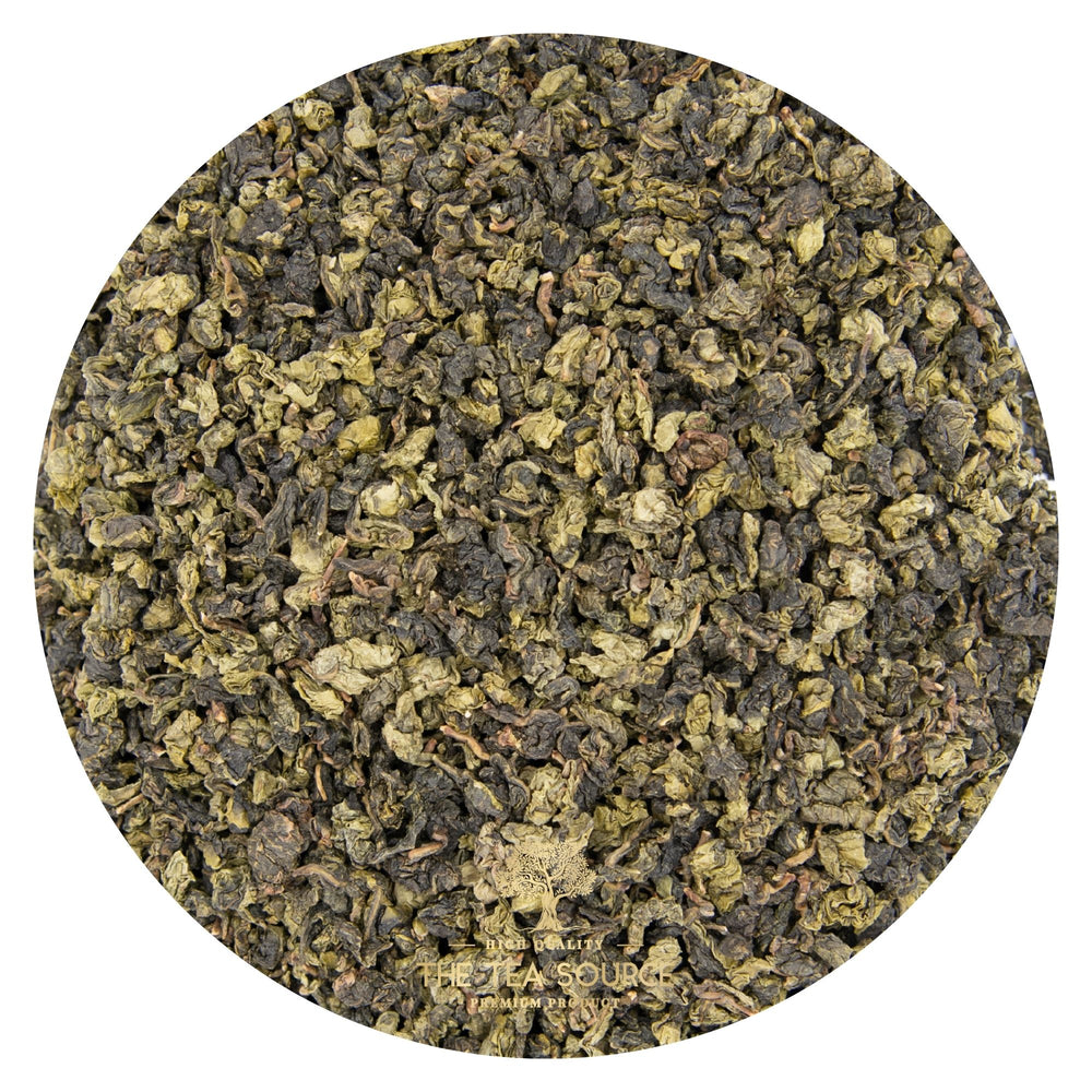 
                      
                        Close-up view of rolled green oolong tea leaves in a circular frame
                      
                    